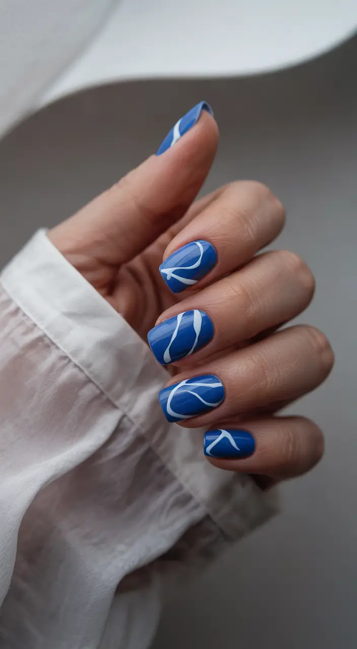 june nails color ideas 2025 Short Blue Waves for Coastal Cool