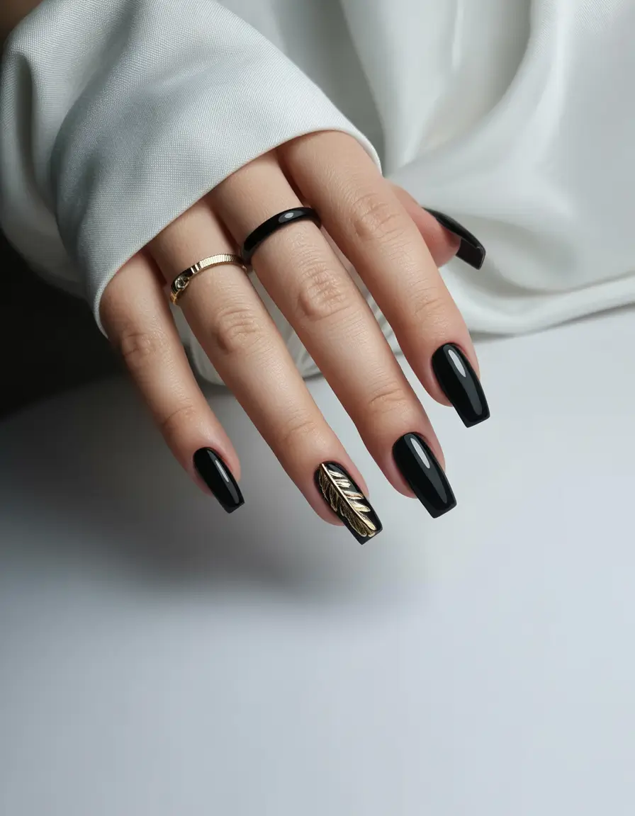 summer black nails ideas 2025 Glossy Black Meets Gold Leaf Drama