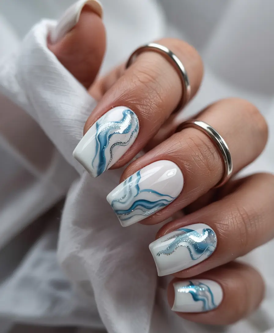 summer blue nails ideas 2025 Ocean Marble with Silver Whispers
