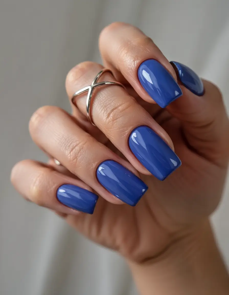 summer blue nails ideas 2025 Indigo Glass Shine