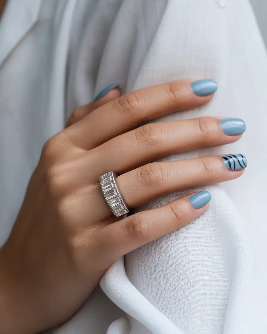 Fall 2025 short nail trends Minimalist Blue With Zebra Detail