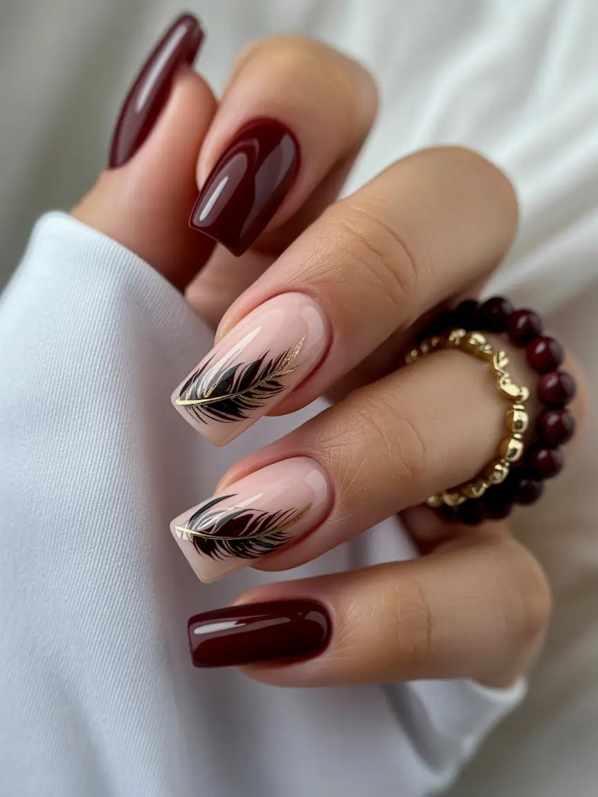 2025 Dark Fall Nails Burgundy and Nude with Feather Detail