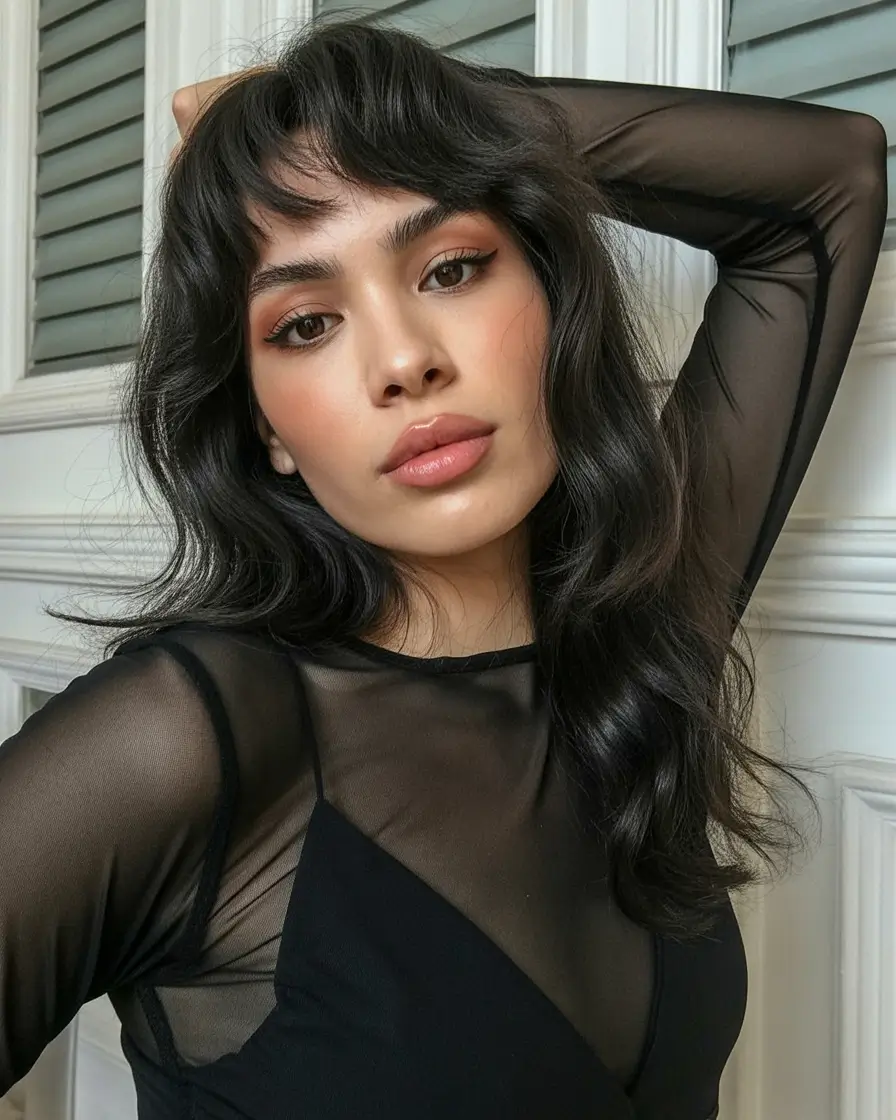 deep winter hair colors 2025-2026 Long Dark Waves with Wispy Bangs