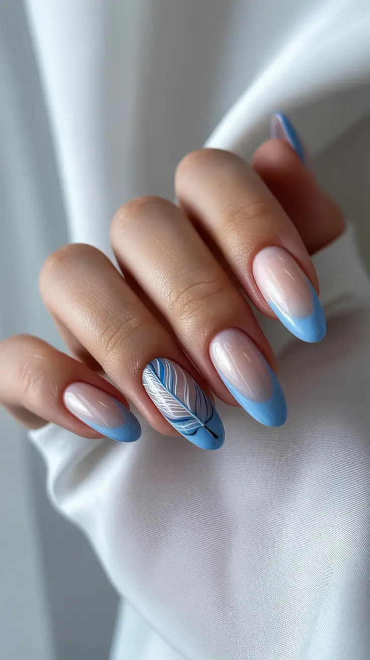 Winter 2025–2026 blue french manicure with feather art