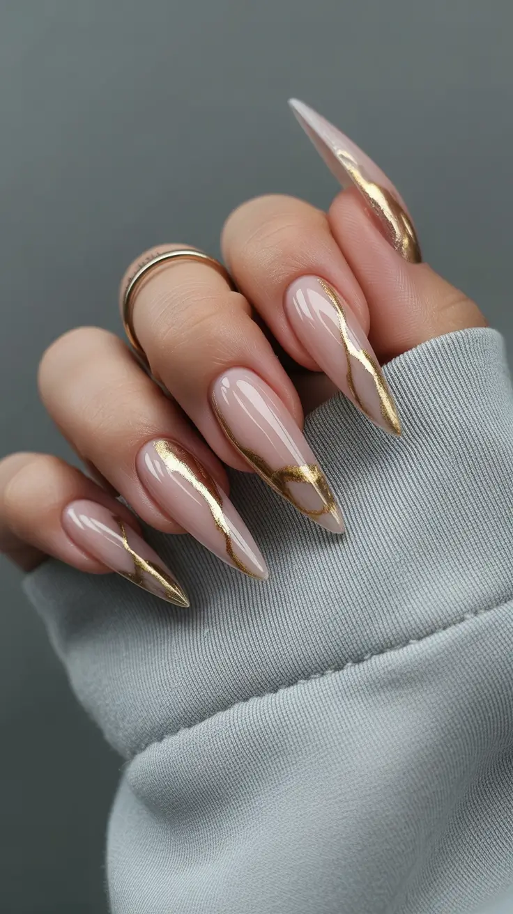 stiletto nails 2026 Nude Stiletto Nails with Gold Accents