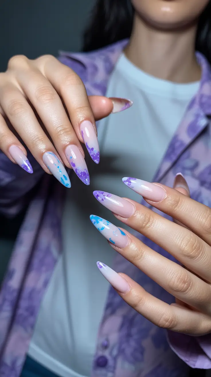 stiletto nails 2026 Milky Pink Stiletto Nails with Purple Blue Splatter Tips