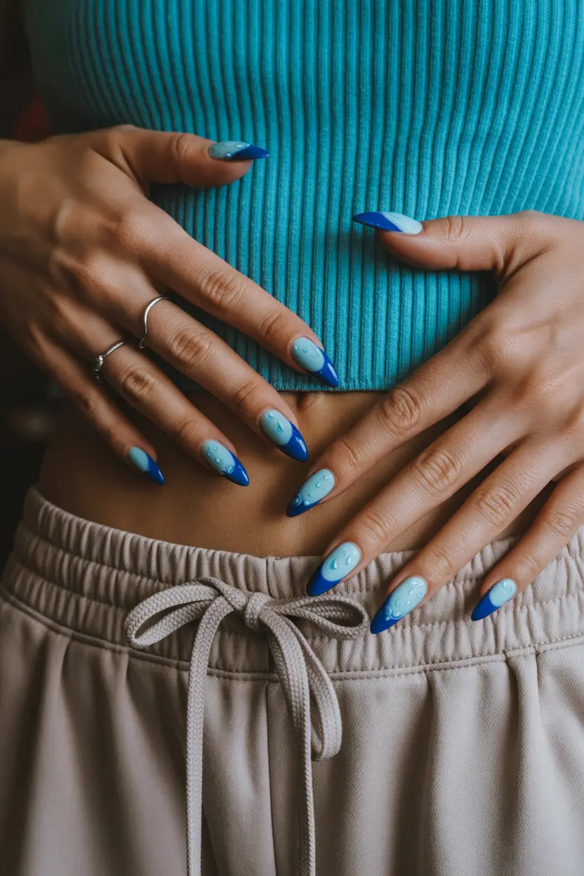cute spring almond nails 2026 Blue Almond Nails with Playful Water Drop Art