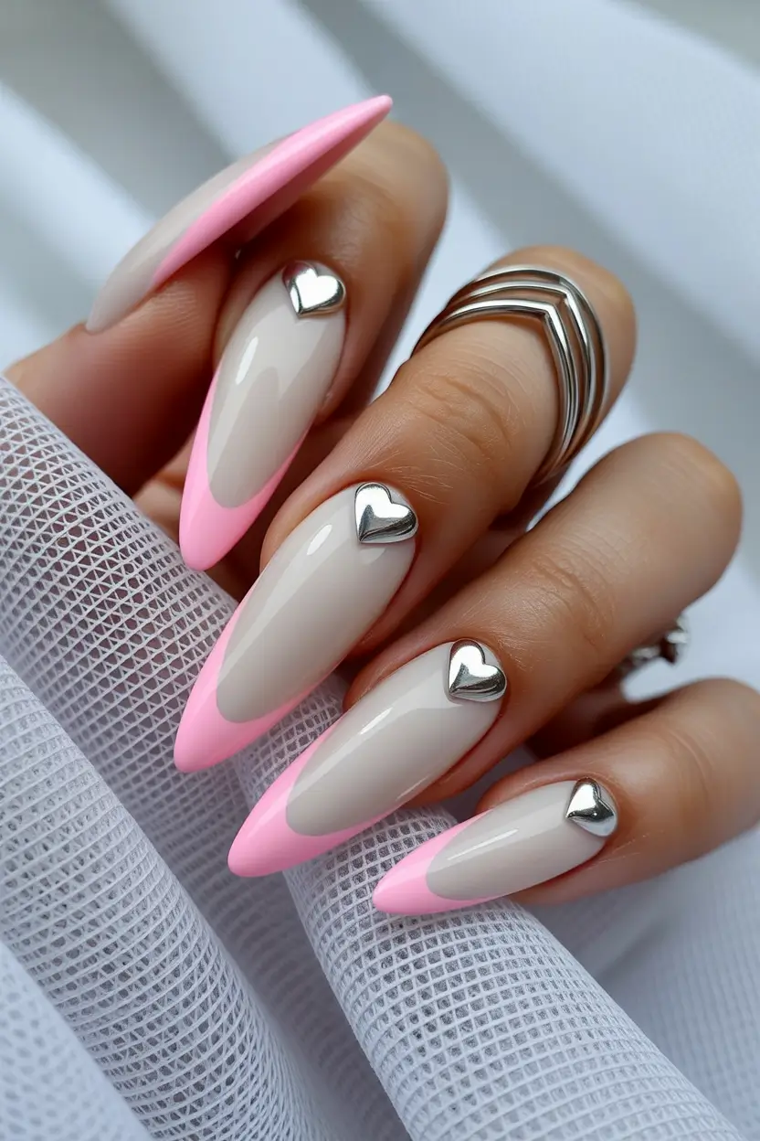 pink spring nails ideas 2026 Pink French Nails with Metallic Heart Accents