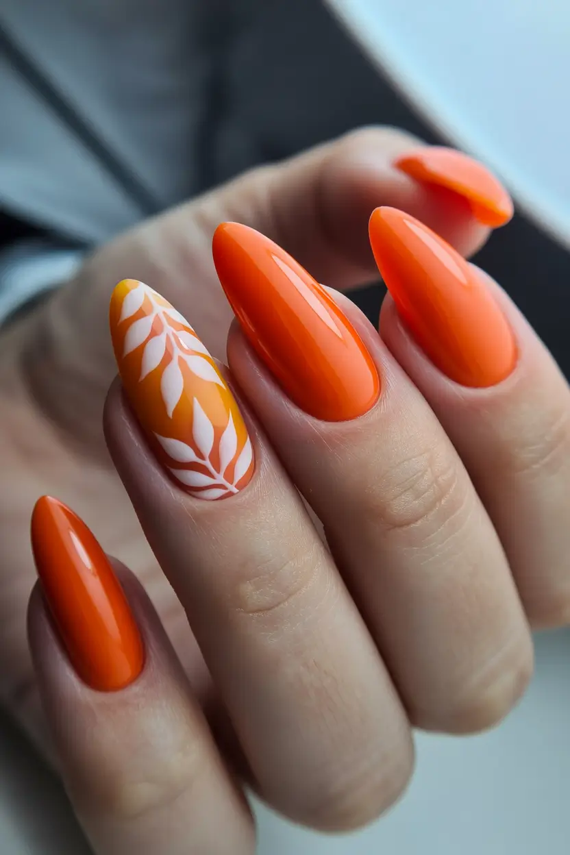 spring orange nails 2026 Glossy Orange Almond Nails with Minimal White Leaf Art
