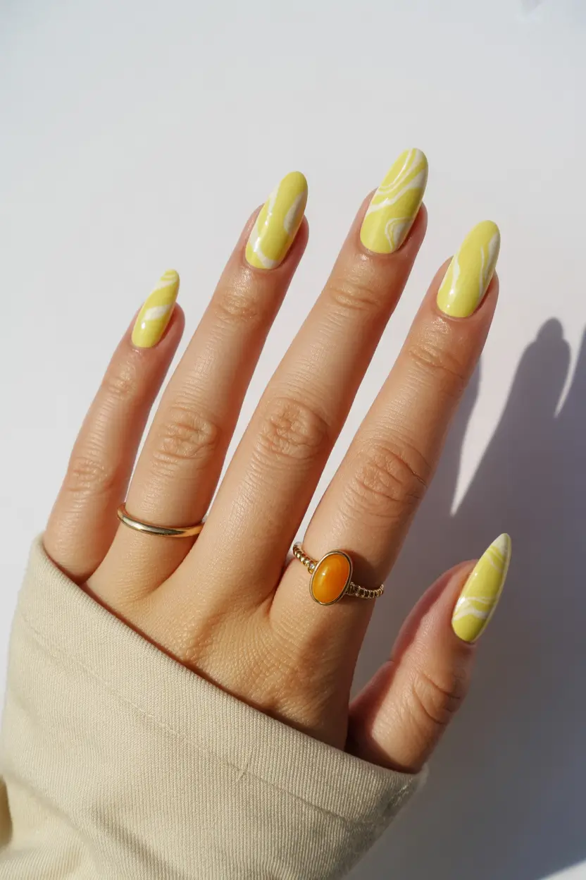 cute yellow spring nails 2026 light lemon marble swirl manicure