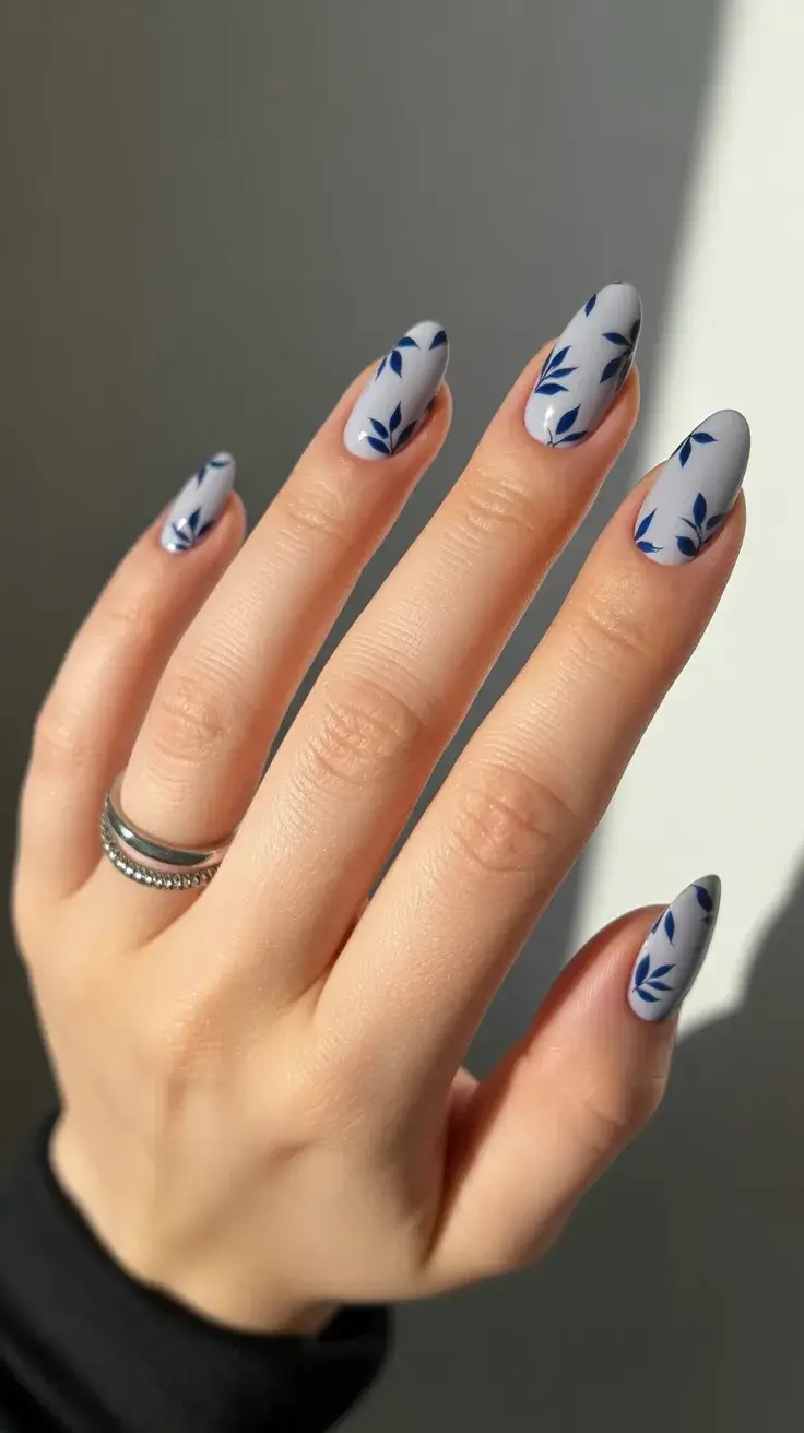 easter nails color ideas 2026 Soft Grey Easter Nails with Blue Botanical Pattern