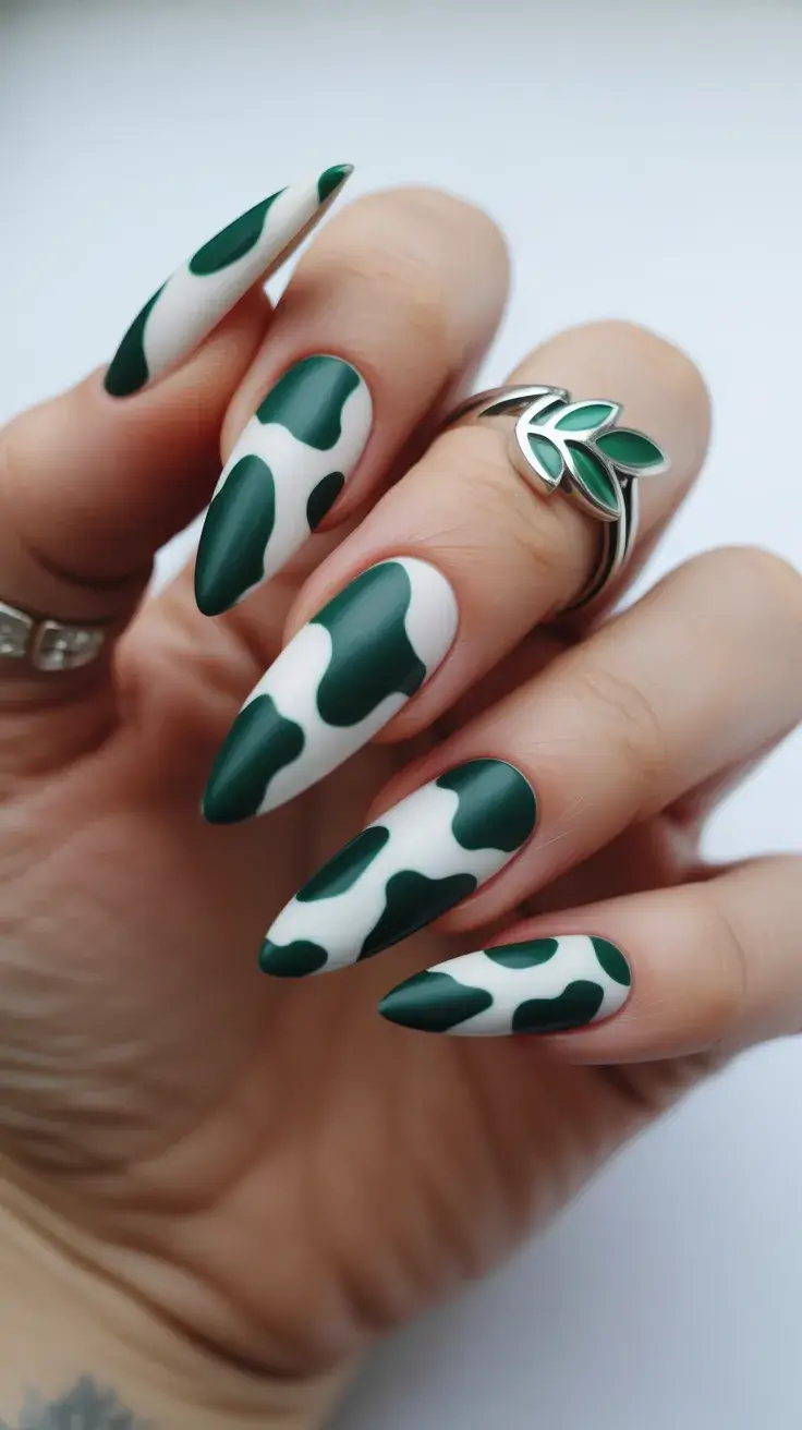 easter nails color ideas 2026 Graphic green almond nails with bold abstract pattern