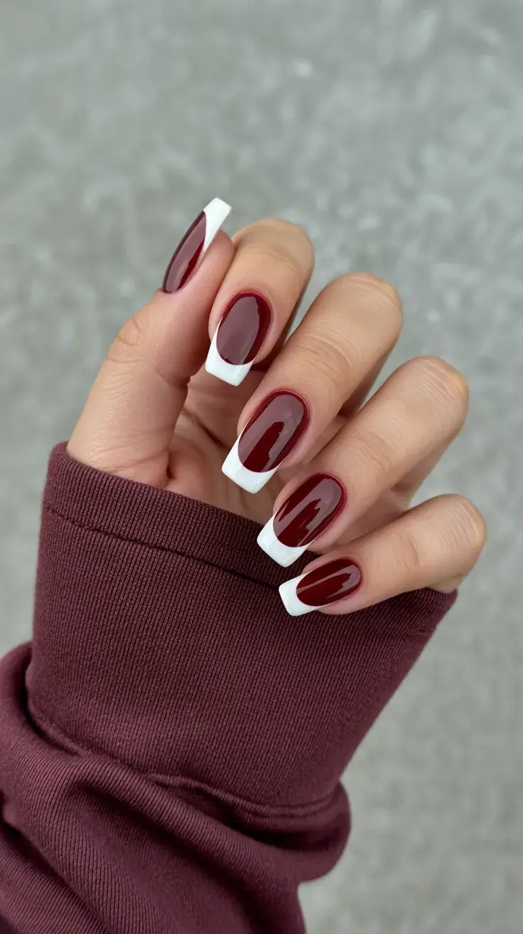 graduation nails ideas 2026 Deep Red Graduation Nails With Bold White French Tips