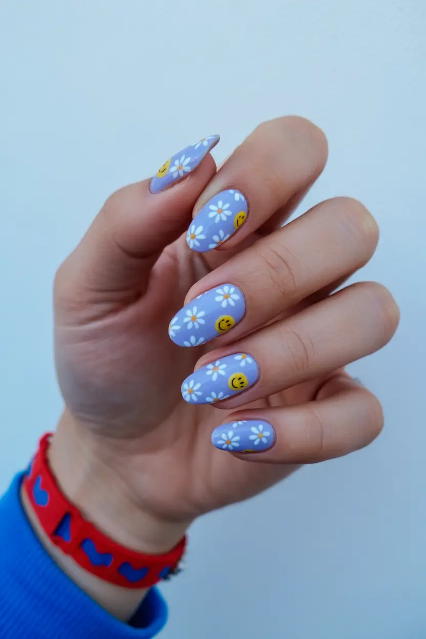 minimalistic spring nail inspo 2026 Blue Daisy Nails with Cute Smiley Details