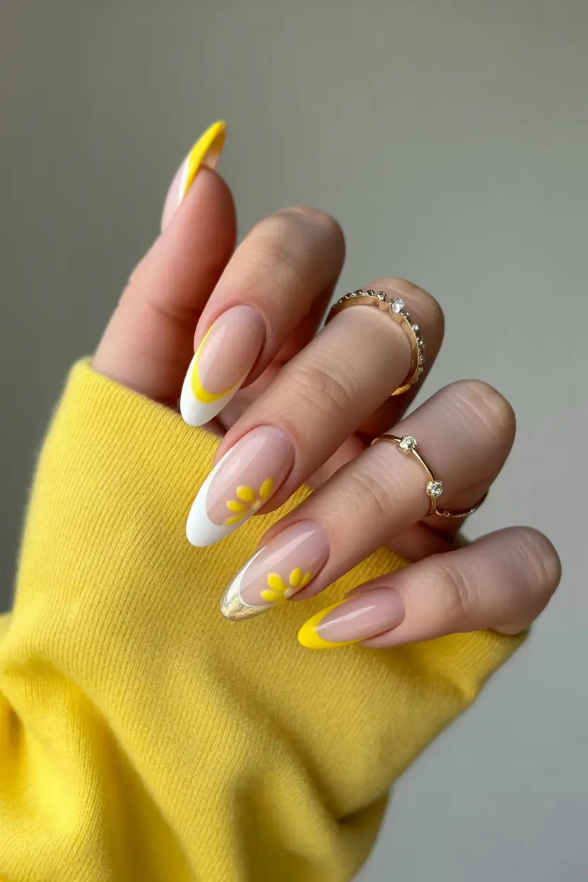 minimalistic spring nail inspo 2026 Yellow French Almond Nails with Tiny Spring Florals