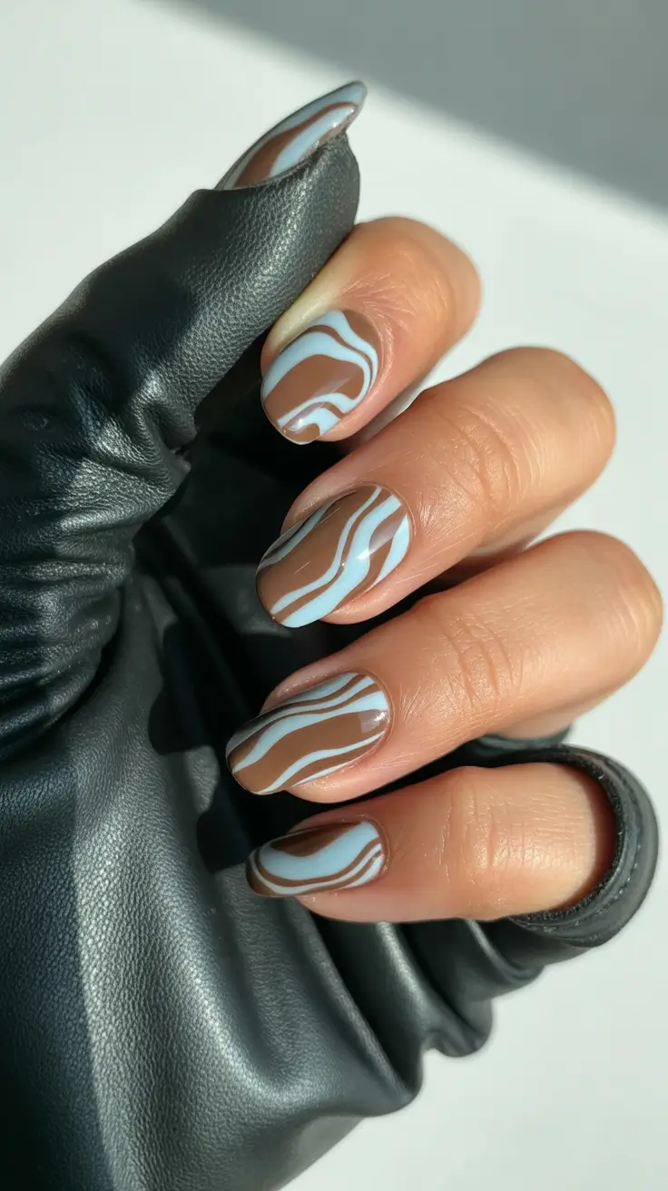 short spring nails 2026 abstract blue swirl nail art