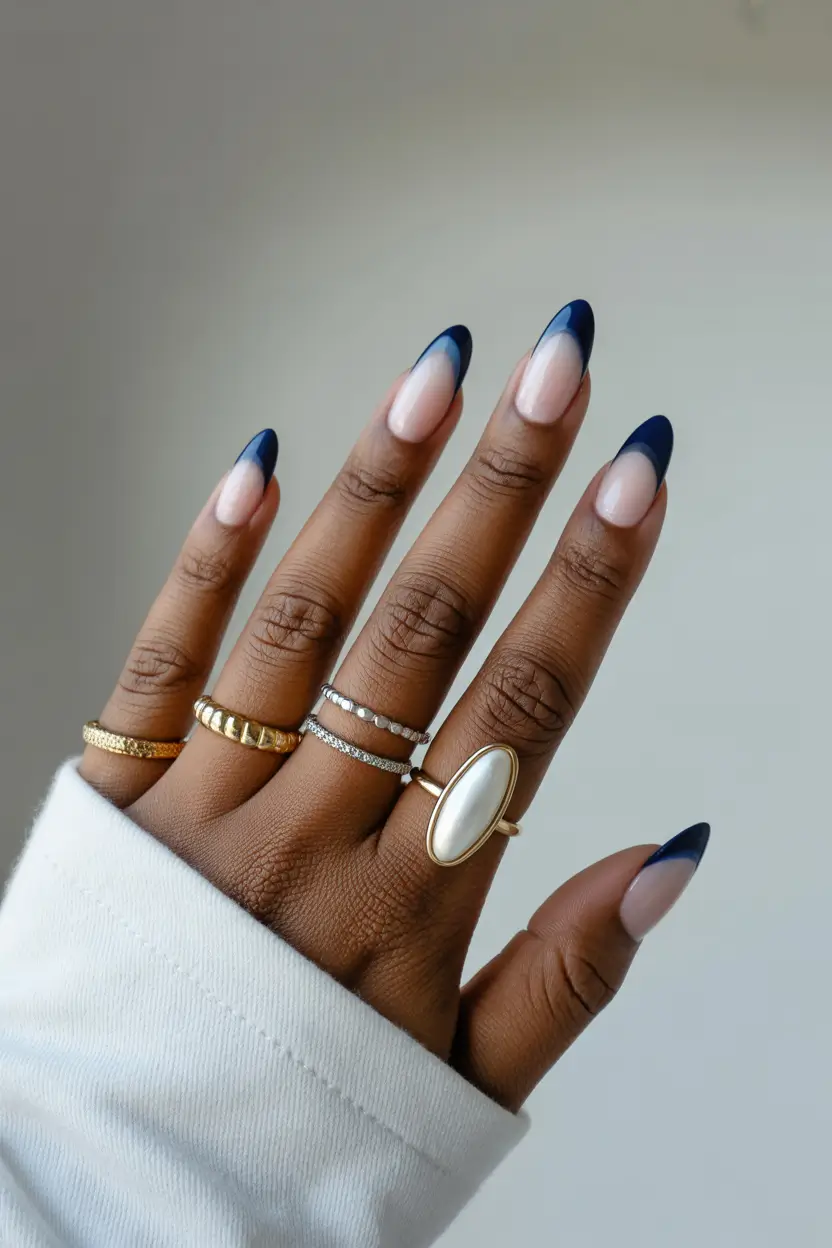spring nails for dark skin 2026 Midnight French with a Soft Nude Base