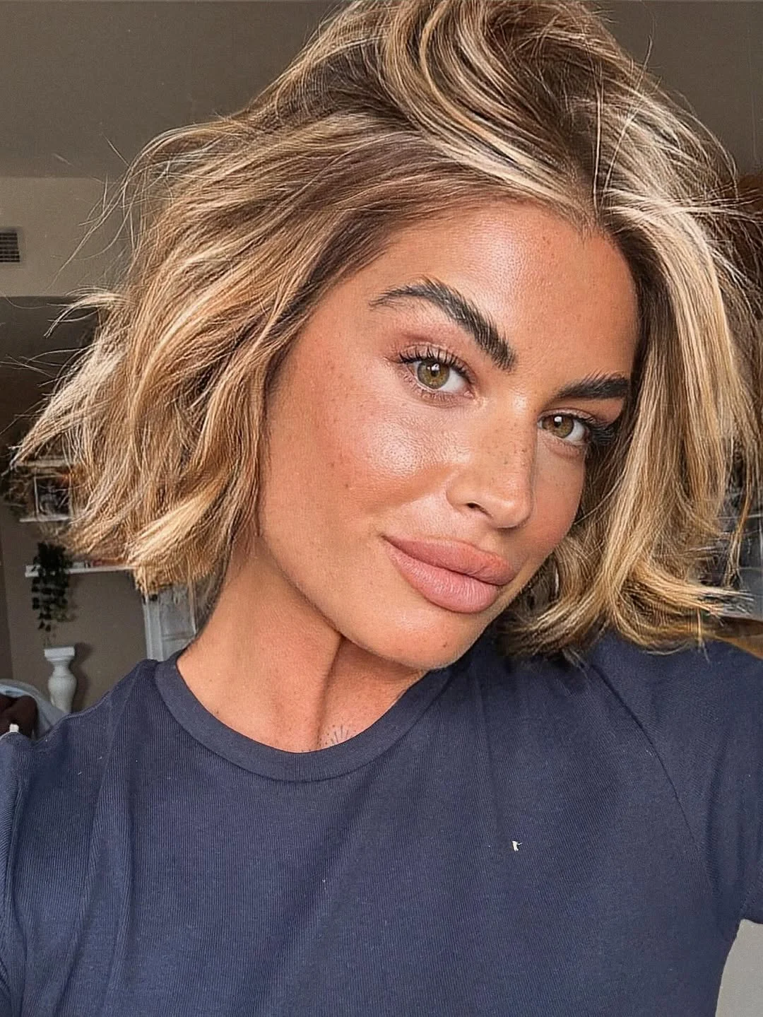 edgy summer short haircuts 2026 Textured Honey Blonde Wavy Bob Energy