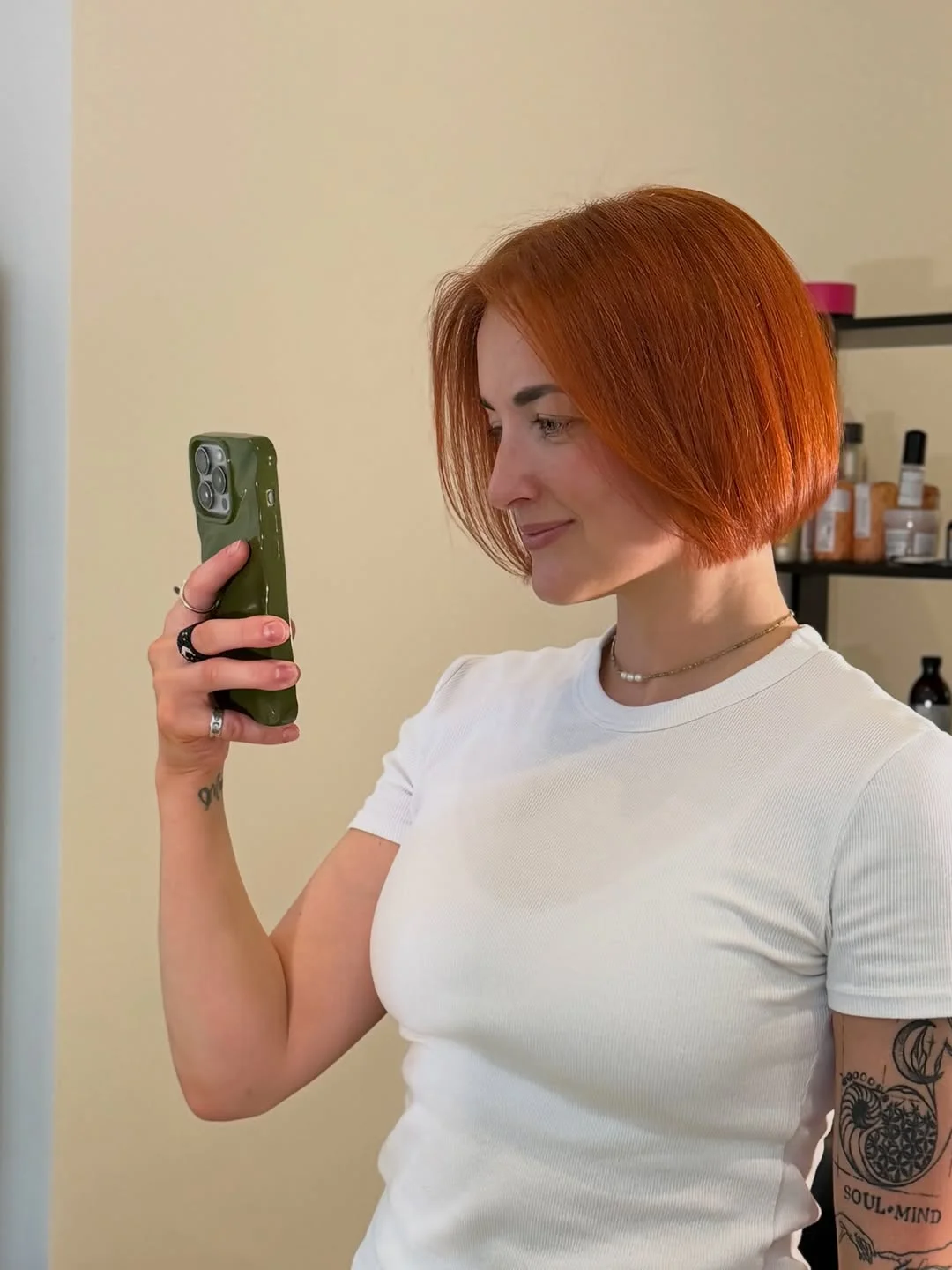 edgy summer short haircuts 2026 Sharp Ginger Blunt Bob Confidence
