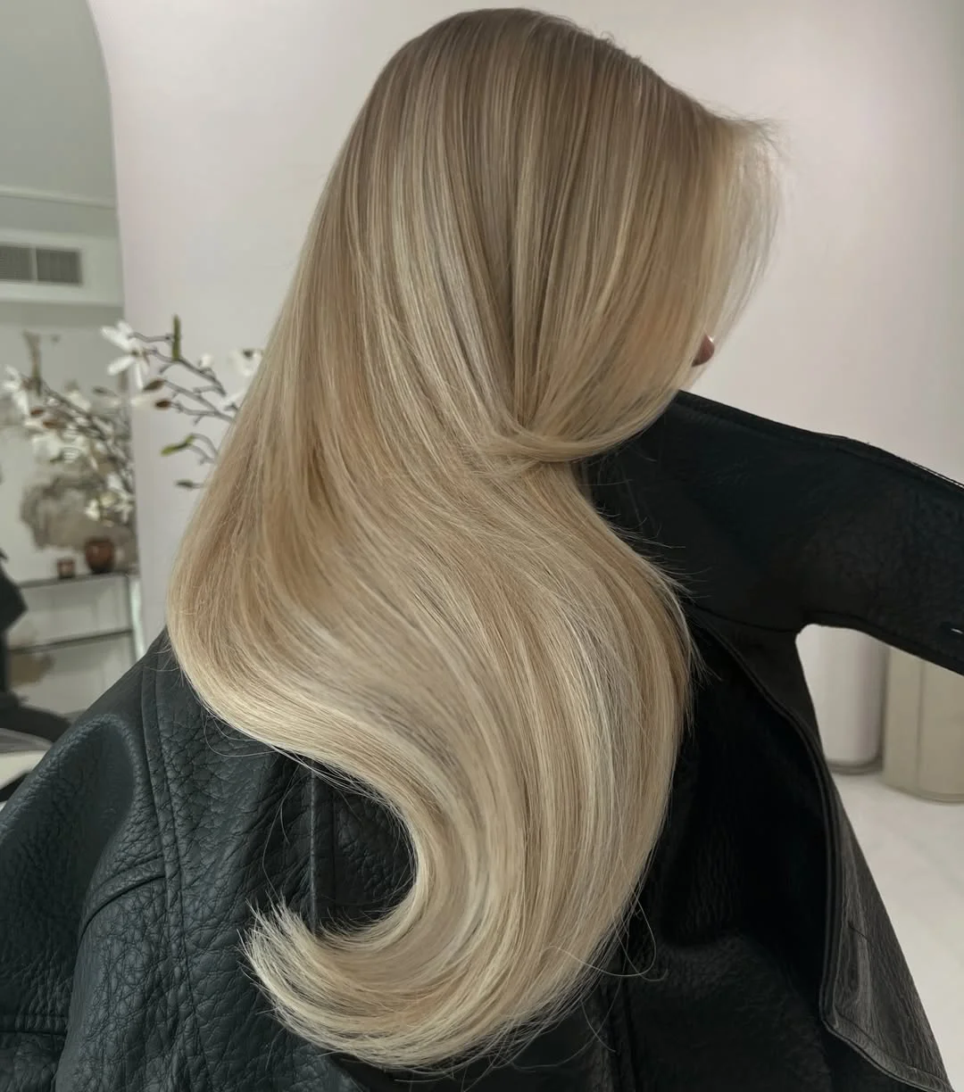 flattering summer haircut for round face 2026 Sleek sculpted ends that give a polished elongated finish