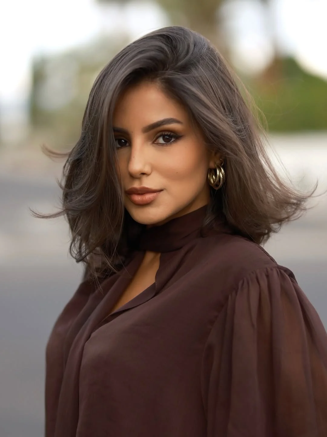 layered summer haircuts for medium hair 2026 Choppy brunette layers with soft movement