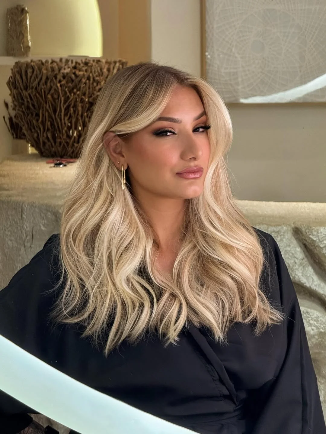 layered summer haircuts for medium hair 2026 Glossy layered blowout with face-framing dimension