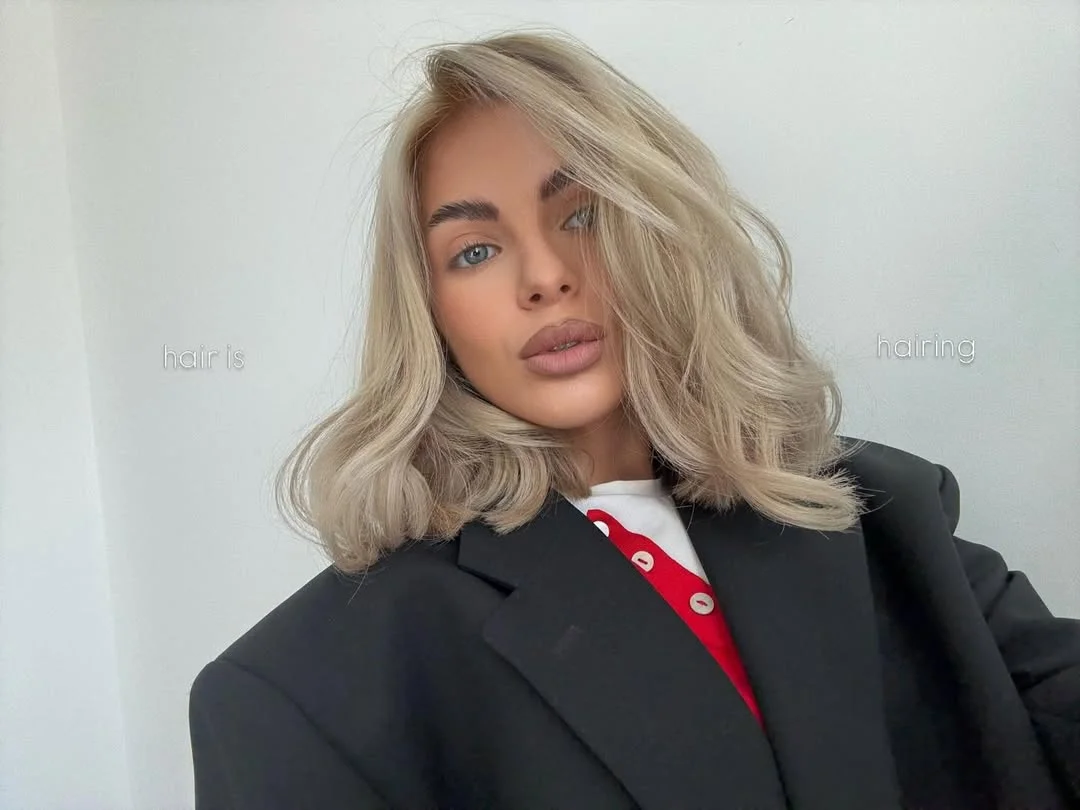 layered summer haircuts for medium hair 2026 Wavy soft volume with modern layered texture