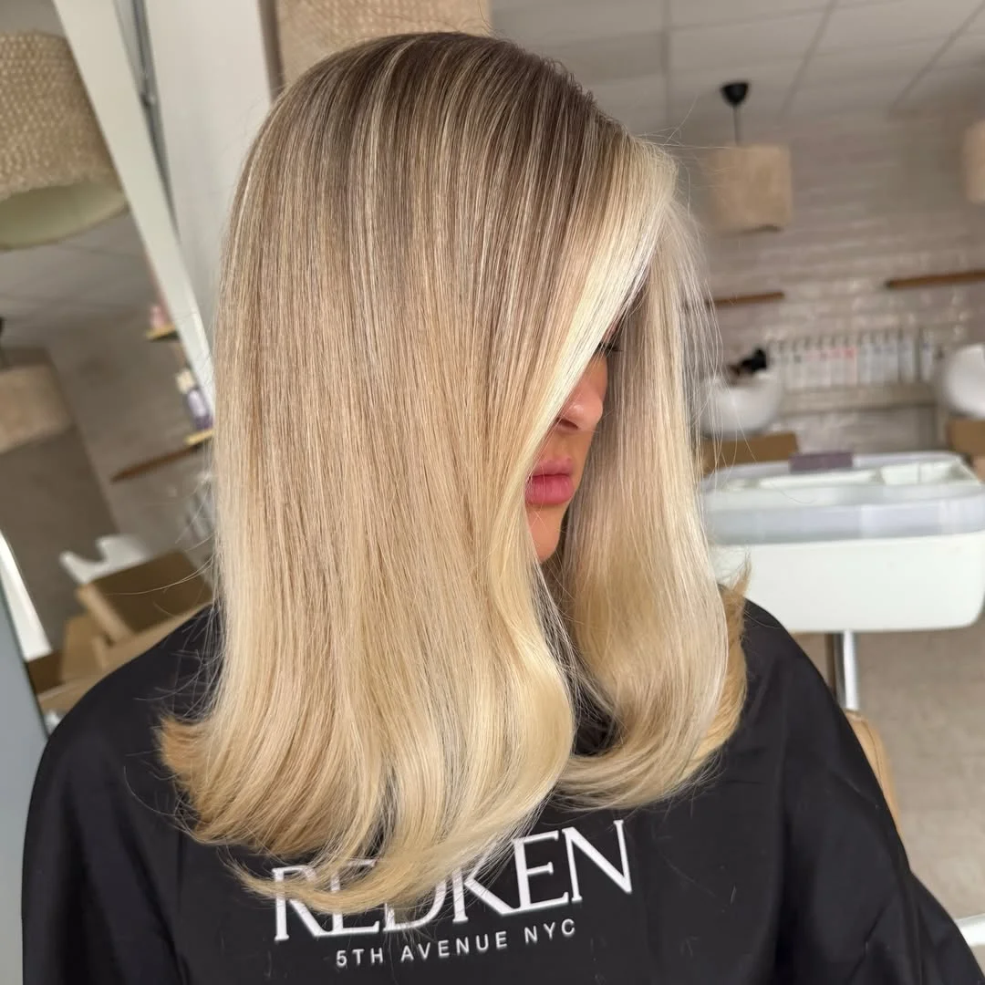 layered summer haircuts for medium hair 2026 Silky blonde layers with smooth dimensional flow