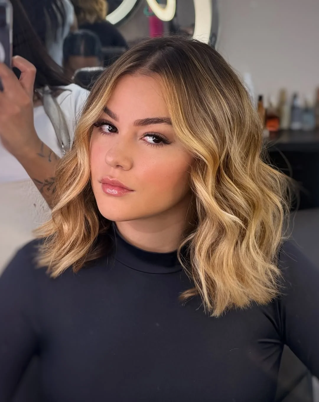 layered summer haircuts for medium hair 2026 Glossy Wavy Mid Length Layers