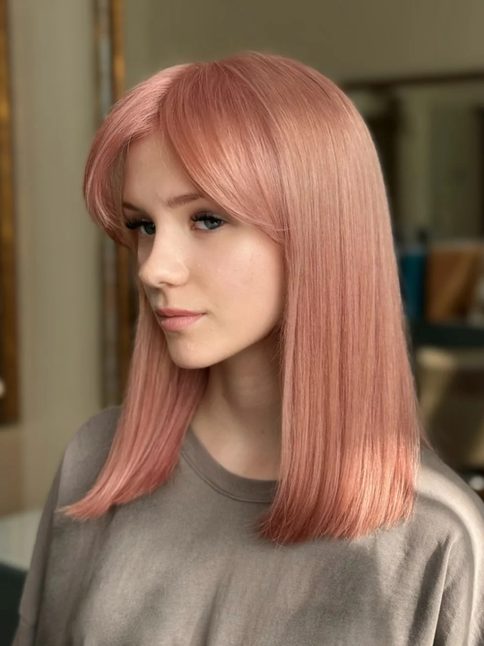 layered summer haircuts for medium hair 2026 Sleek Pastel Layers with Soft 90s Bangs