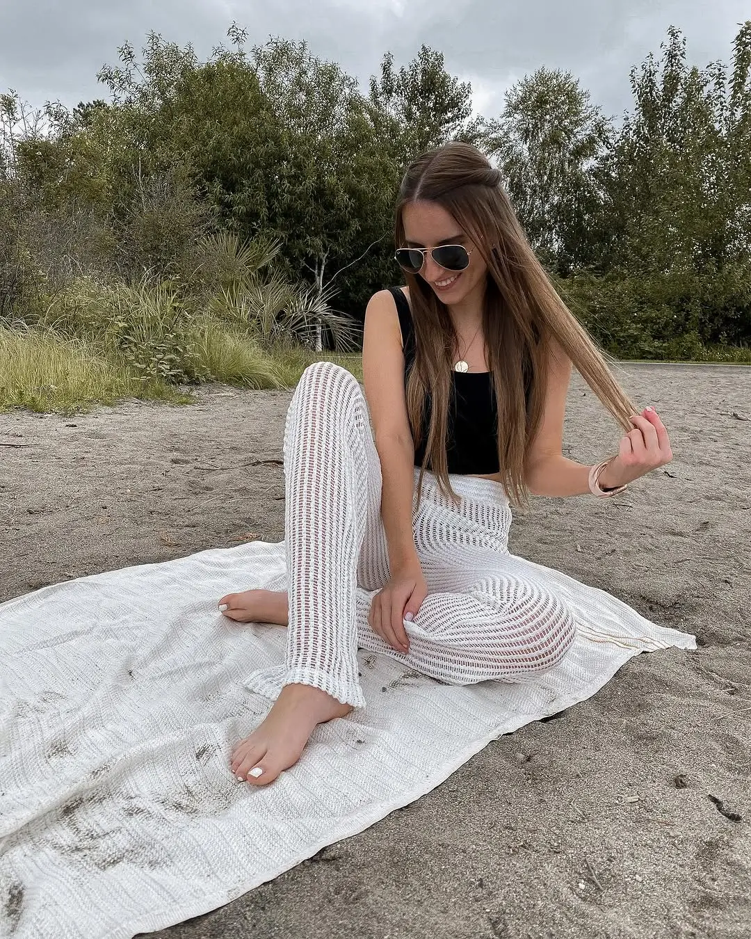 summer beach outfit 2026 Sheer Knit Pants and Minimal Black Top