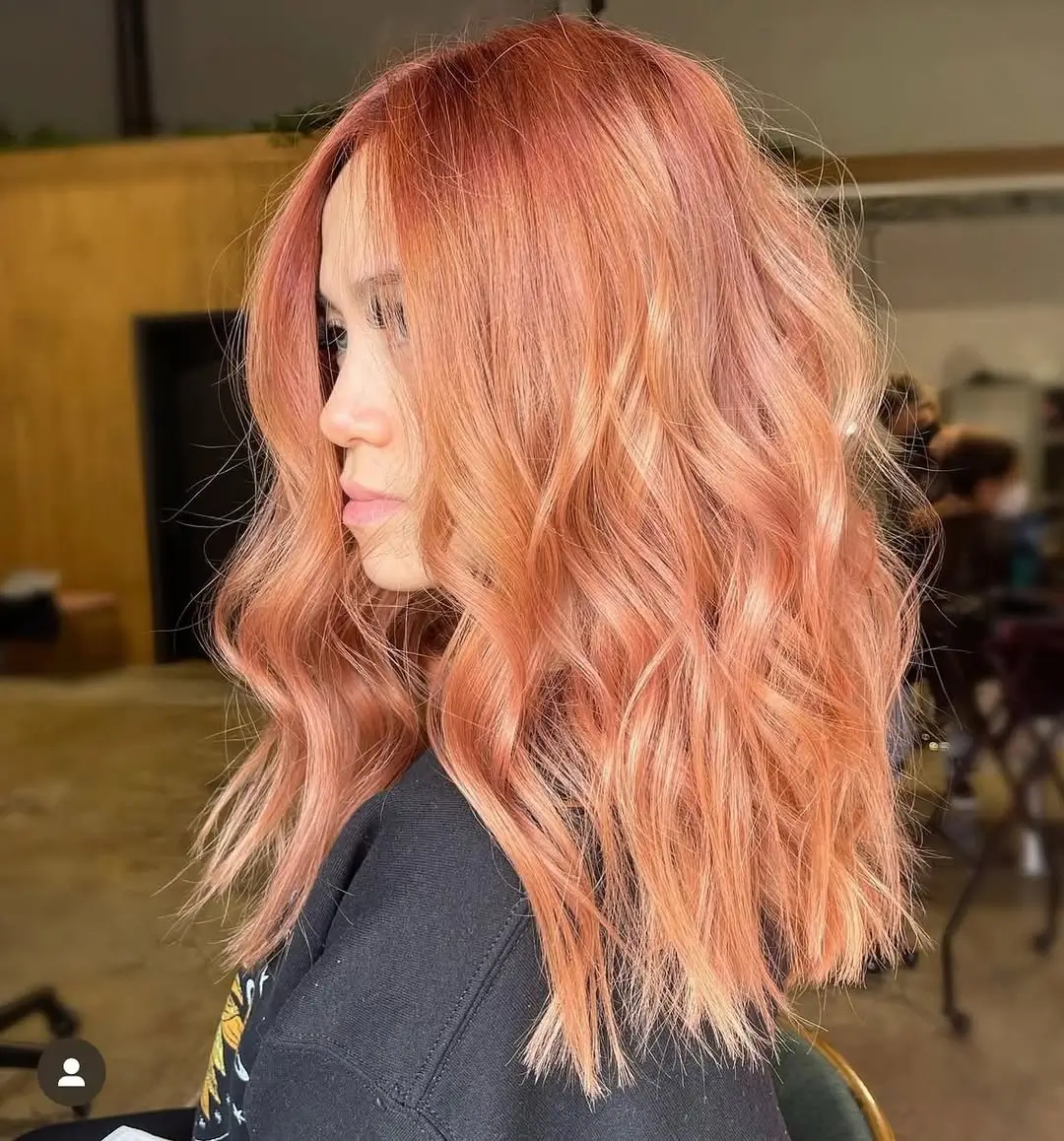 summer blonde hair color for women 2026 Soft Peach Strawberry Blonde With Sunlit Texture