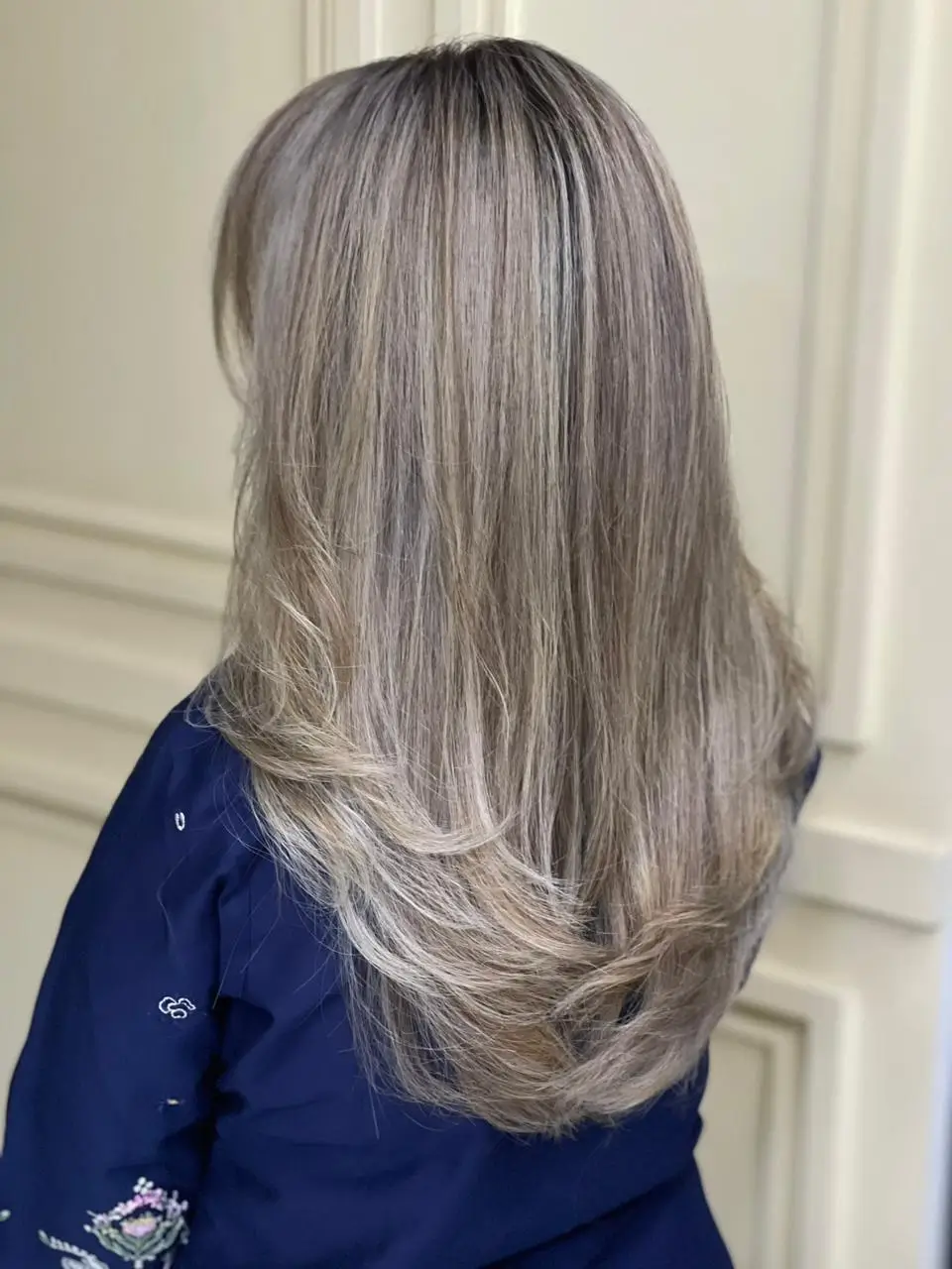 summer blonde hair color for women 2026 Cool Ash Blonde with Long Feathered Ends
