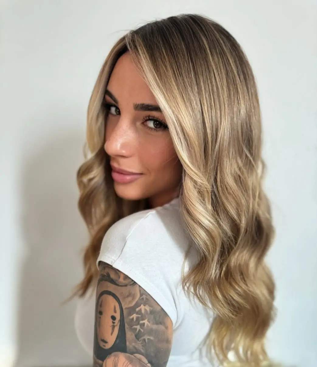 summer blonde hair color for women 2026 Golden Caramel Blonde with Soft Contrast