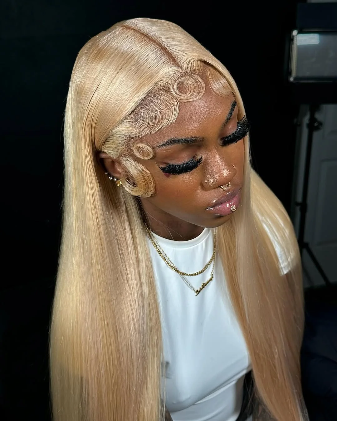 summer hair color for brown skin women 2026 Silky Platinum Blonde with Sculpted Edges