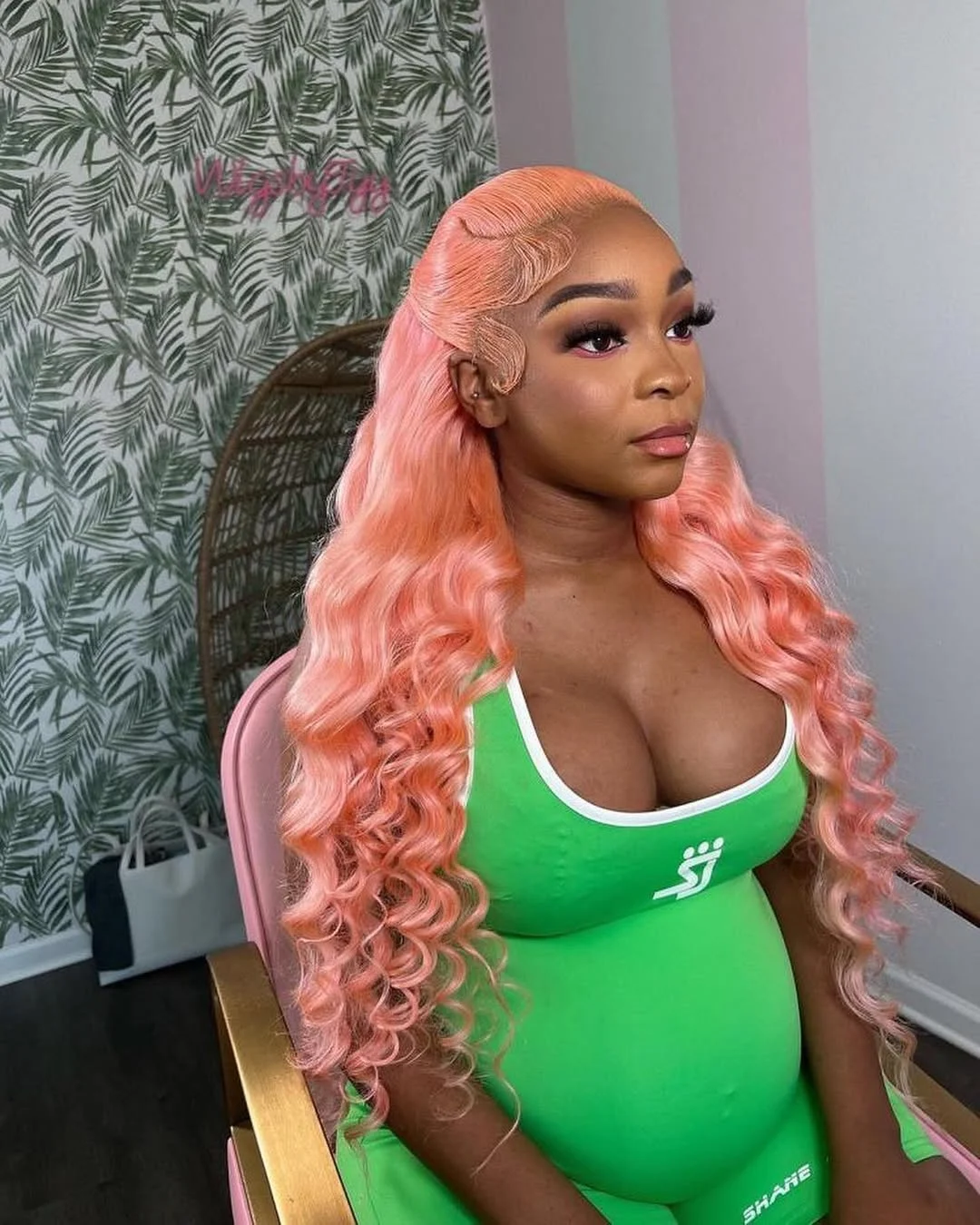 summer hair color for brown skin women 2026 Peachy Pink Long Waves with Sculpted Baby Hair