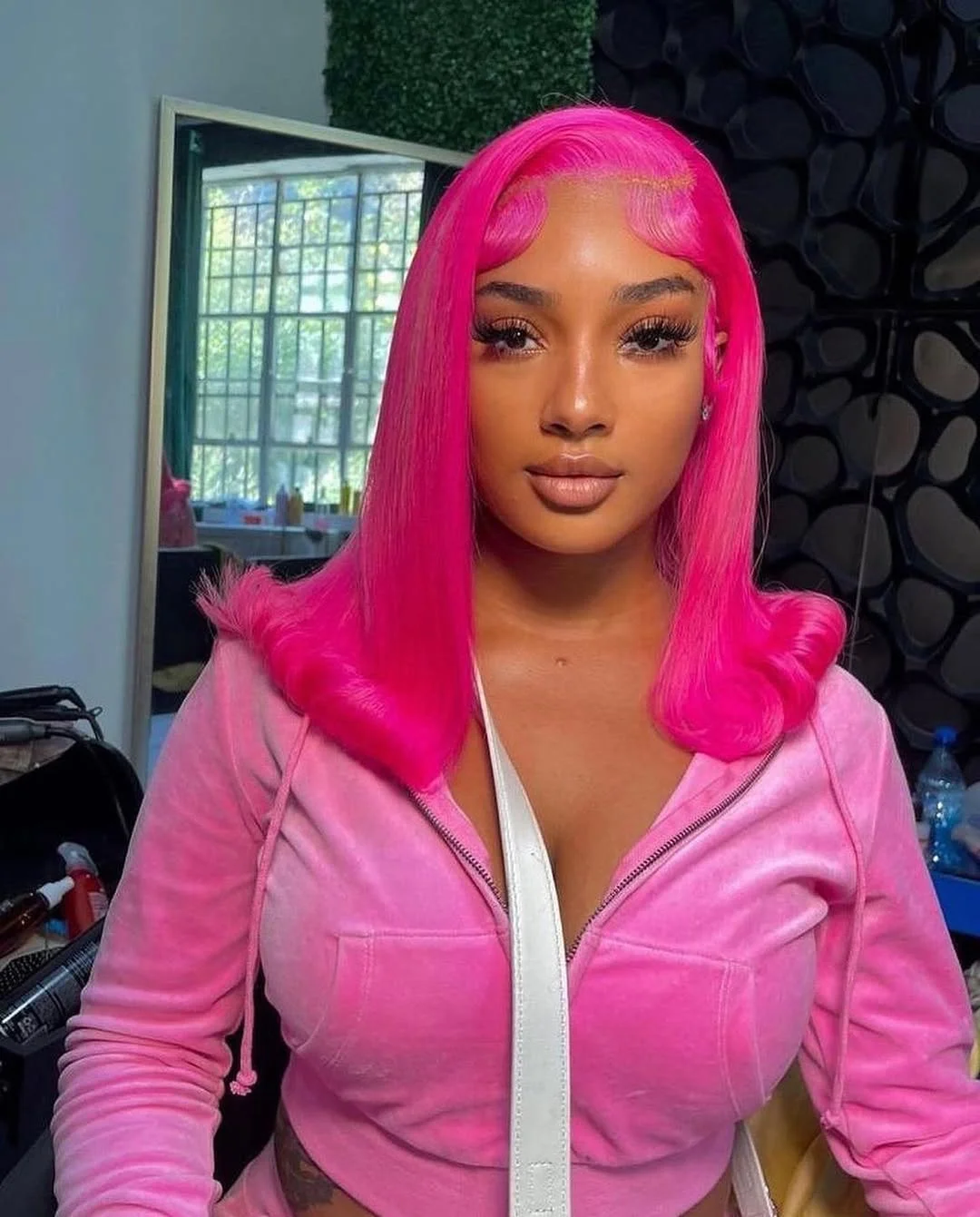 summer hair color for brown skin women 2026 Hot Pink Sleek Flip with High Gloss Finish