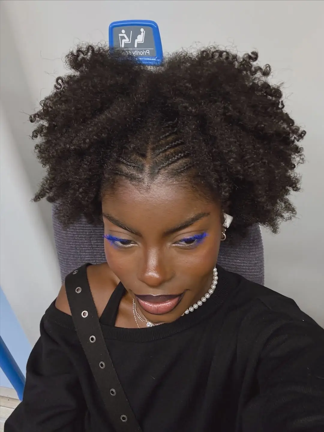 summer hair color for dark skin women 2026 Natural curly volume with subtle braiding detail