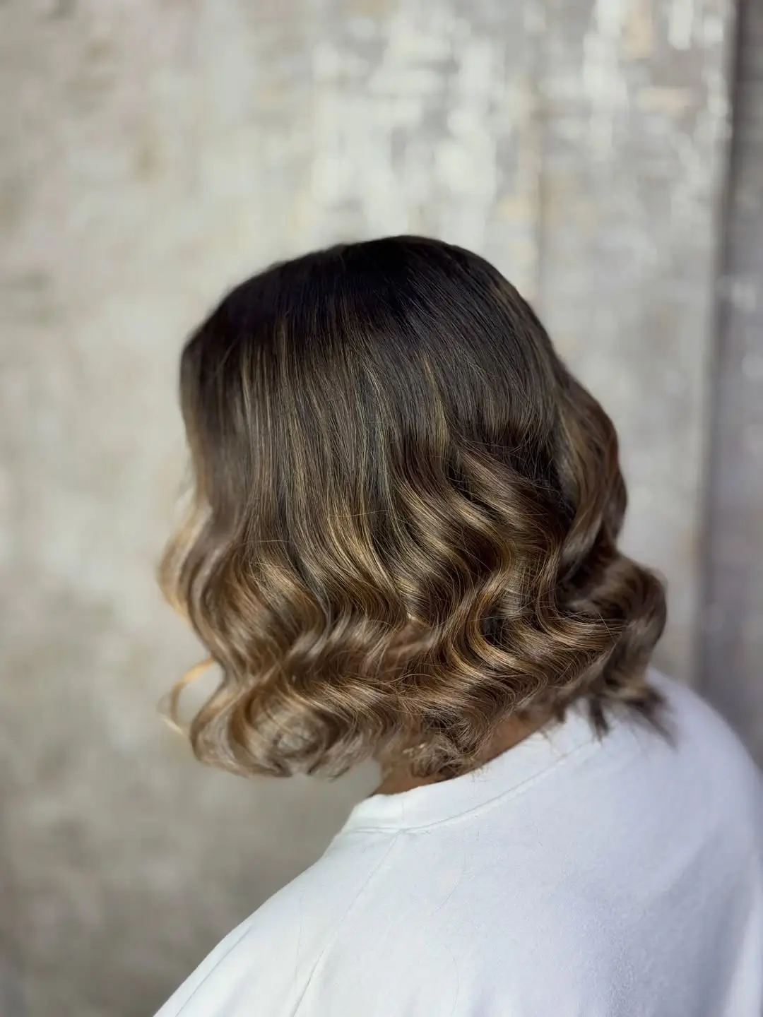 summer hair color for dark skin women 2026 Soft Ash Brown Waves with Light Dimension