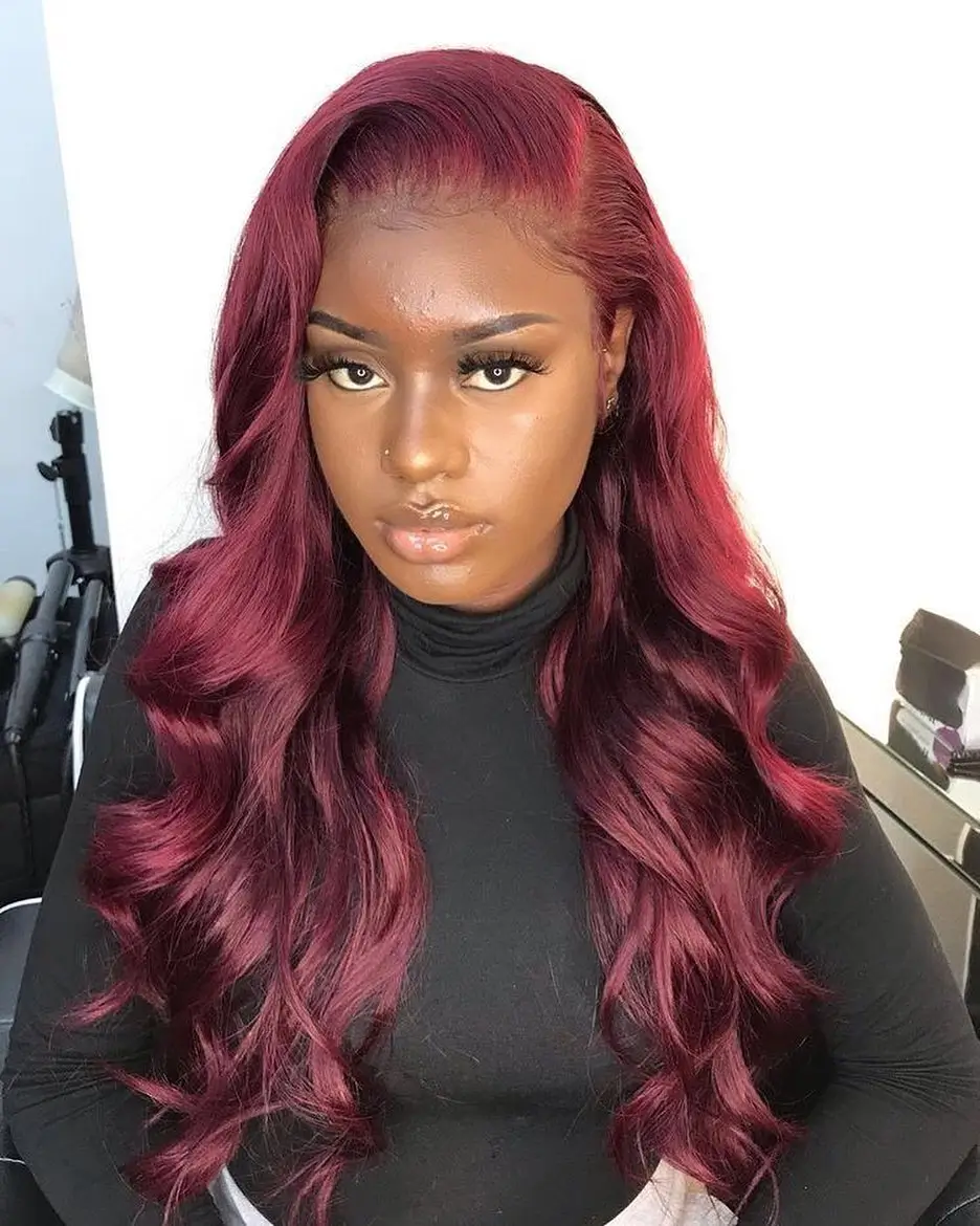 summer hair color for dark skin women 2026 Deep Berry Red Waves with Full Glam Finish