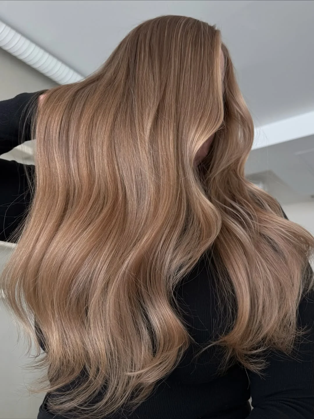 summer hair color for light skin women 2026 Muted Sandy Brown with Glossy Summer Movement