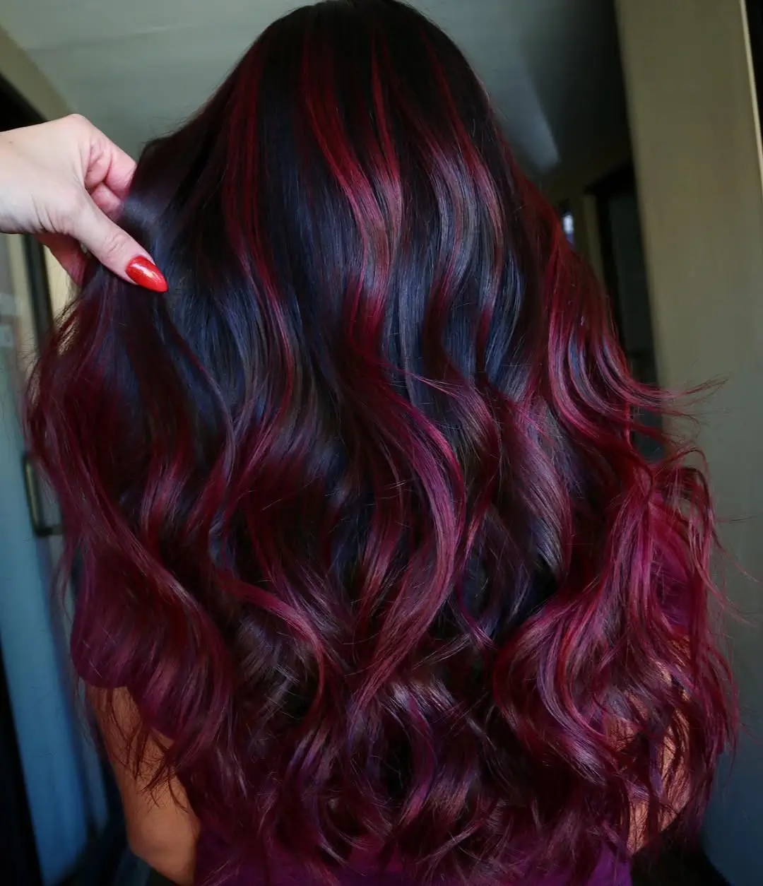summer hair color for tan skin women 2026 Deep Burgundy Waves with Unnatural Red Glow
