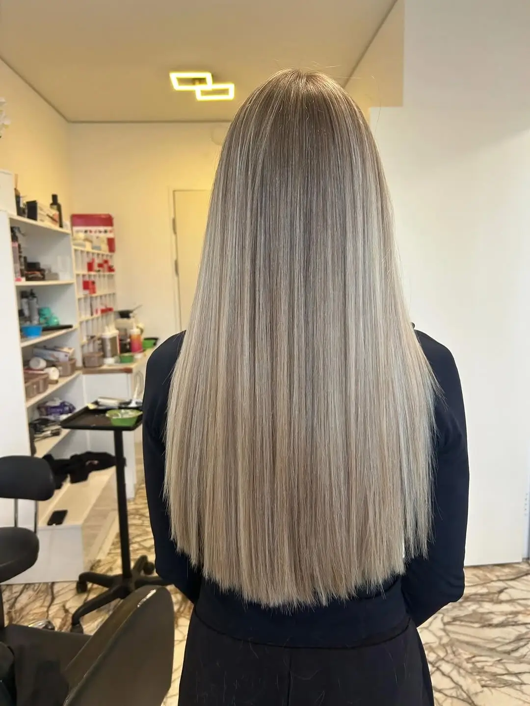 summer hair color for tan skin women 2026 Ultra Light Sleek Blonde with Glass Finish