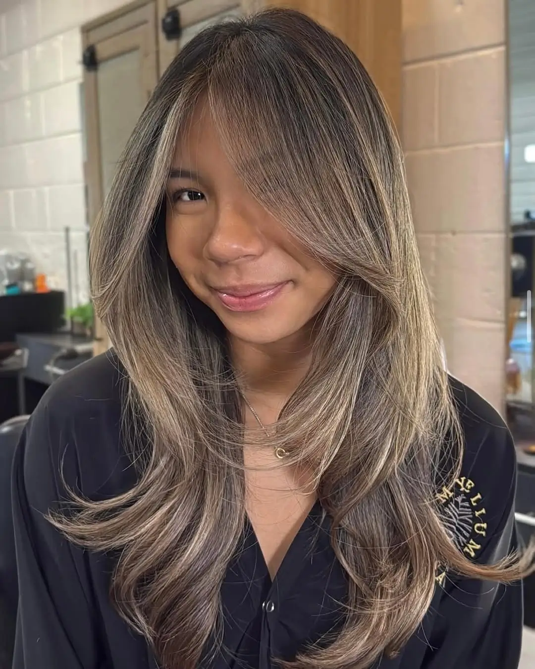 summer hair color ideas for brunette women 2026 Cool Beige Layers with Airy Face Framing