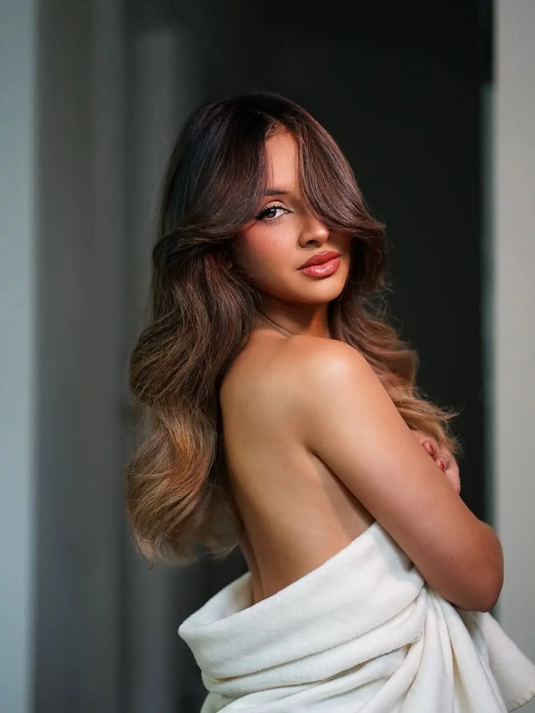 summer hair color ideas for brunette women 2026 Soft Brunette Waves with Subtle Ombre Glow