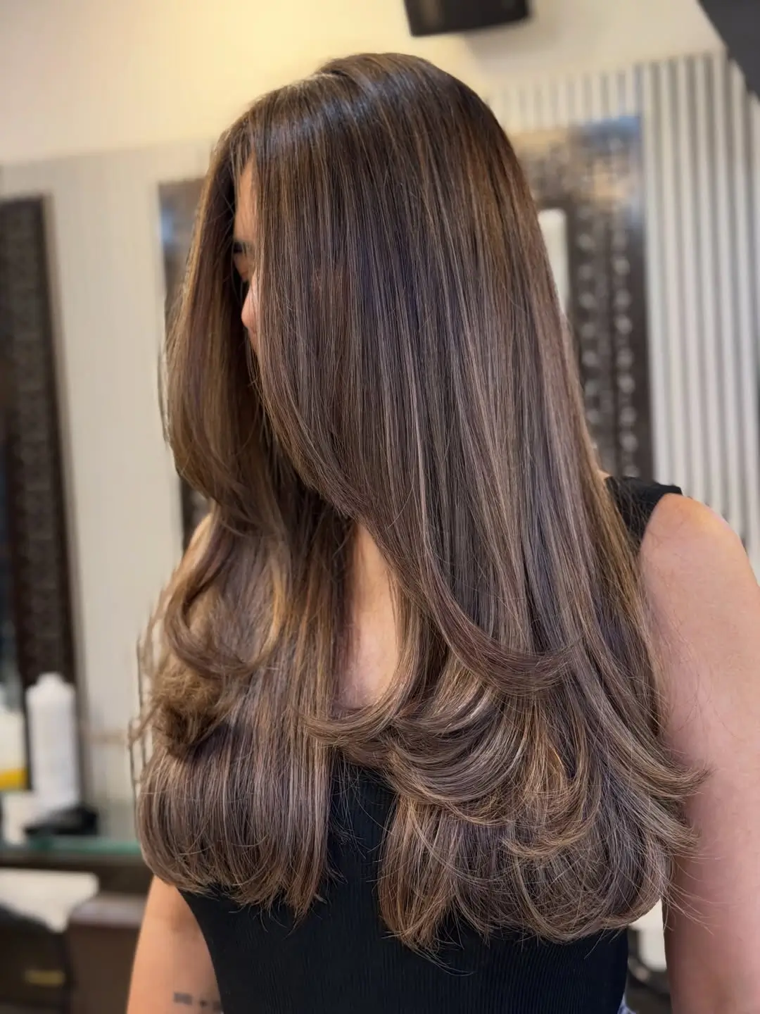 summer hair color ideas for brunette women 2026 Sleek Brunette Layers with Soft Face Framing Highlights