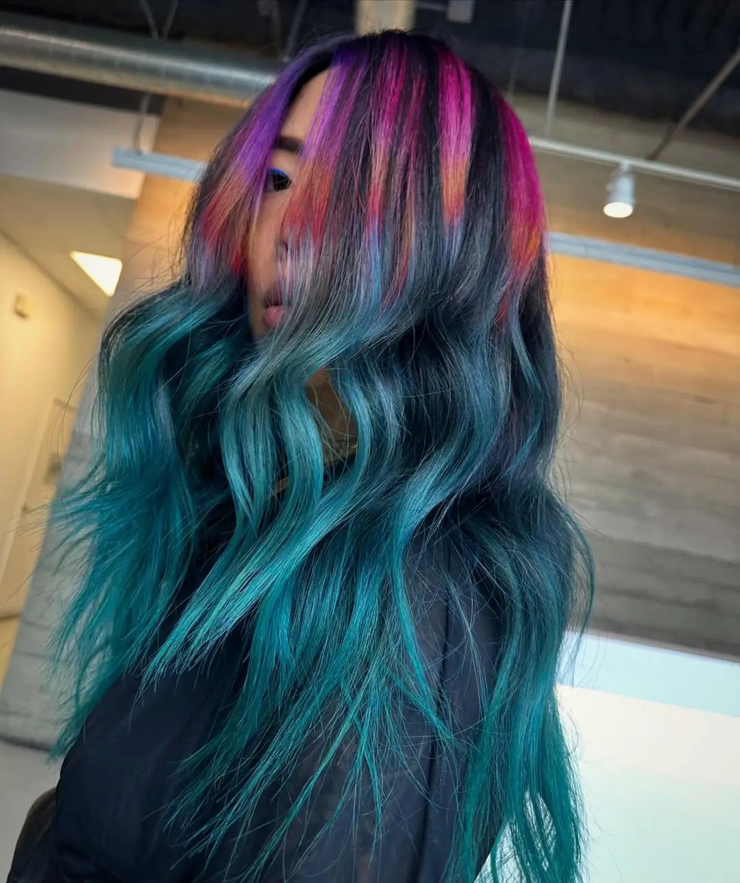 summer hair color ideas for women 2026 Electric mermaid melt with bold contrast