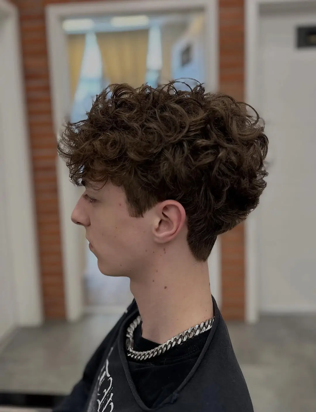 summer haircuts for boys 2026 Full Curly Volume with Tapered Neckline