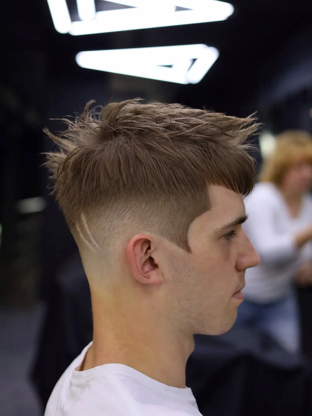 summer haircuts for boys 2026 Textured Fade with Graphic Detail