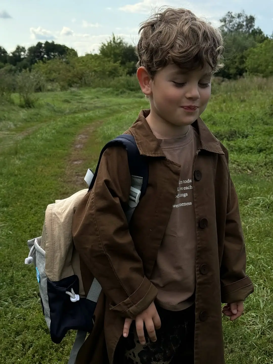 summer haircuts for boys 2026 Natural Soft Waves with Playful Volume